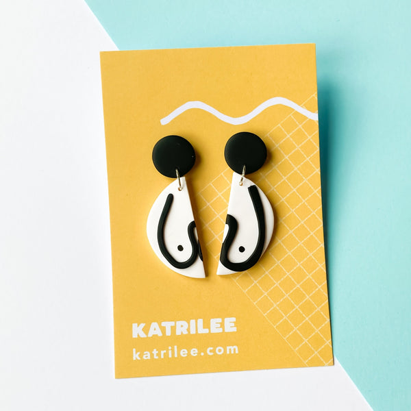 The Mammarlee Half Circle Dangle Boob Earrings - Black and White - Katrilee