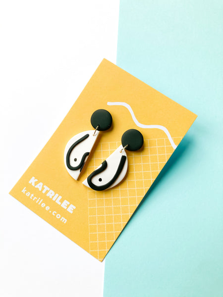 The Mammarlee Half Circle Dangle Boob Earrings - Black and White - Katrilee