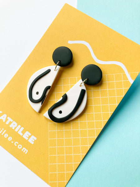 The Mammarlee Half Circle Dangle Boob Earrings - Black and White - Katrilee